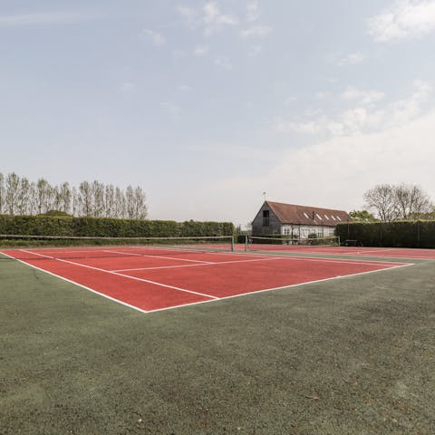 Enjoy a game of tennis with family or friends