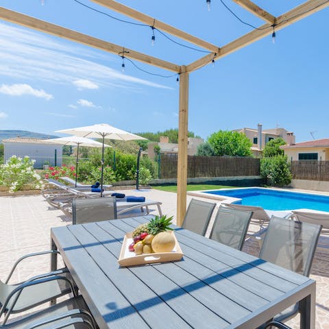 Serve up a freshly grilled meal at the outdoor dining table