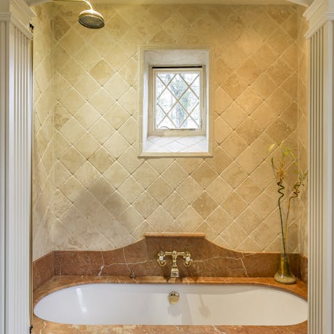 Run a bubble bath and soak in the sumptuous tub