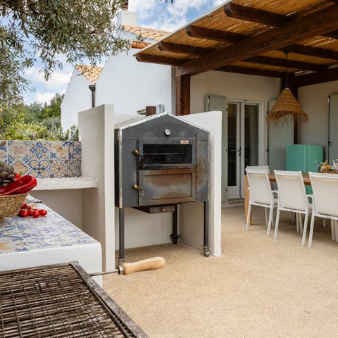Fire up the grill in the outdoor kitchen