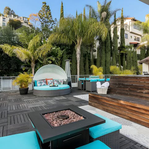 Gather for sunset drinks served straight from the rooftop bar