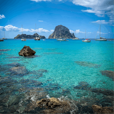 Drive ten minutes to Cala Bassa beach