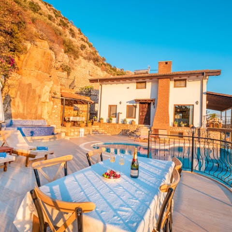 Dine alfresco on the terrace as the sun begins to set