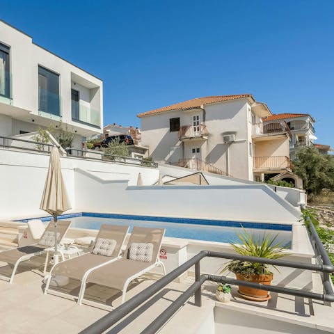 Stroll to the beach or spend lazy days relaxing by the shared pool