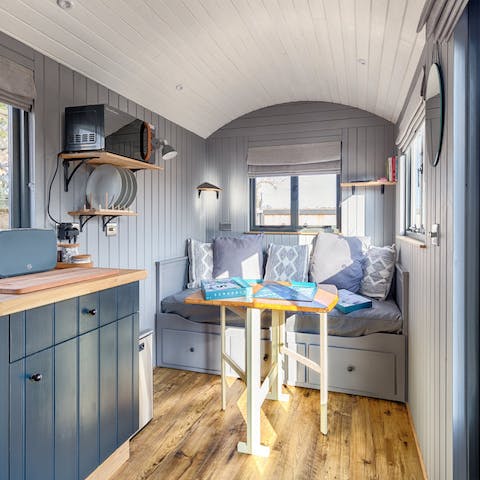 Relax in the cosy indoors with a mug of tea after a day by the sea