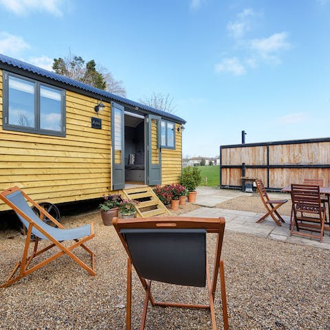 Enjoy sunny morning coffees on the deck chairs outside the home