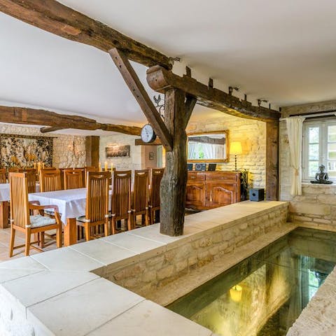 Peep through the viewing panel to see the stream running through the house