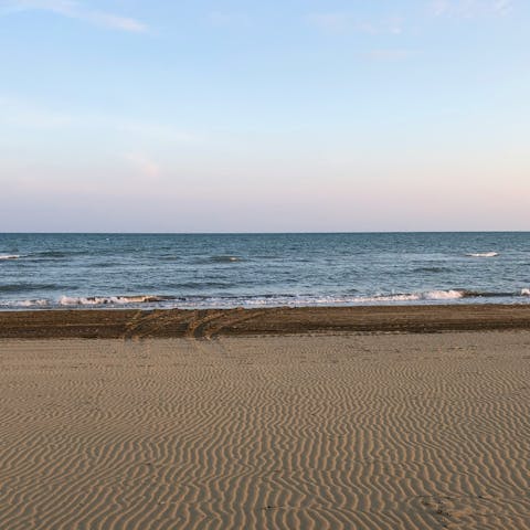 Stick your toes in the sand at Corniglia beach, a fifteen-minute walk away