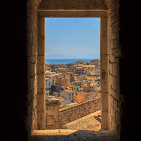 Explore Corfu's atmospheric Old Town, a thirteen-minute drive away