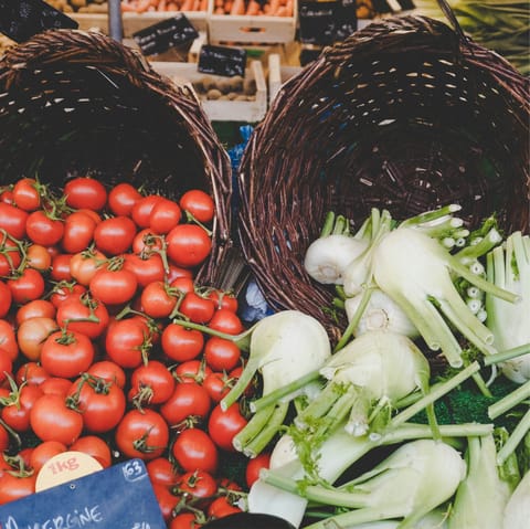 Pick up fresh local produce at Rue Poncelet open-air market