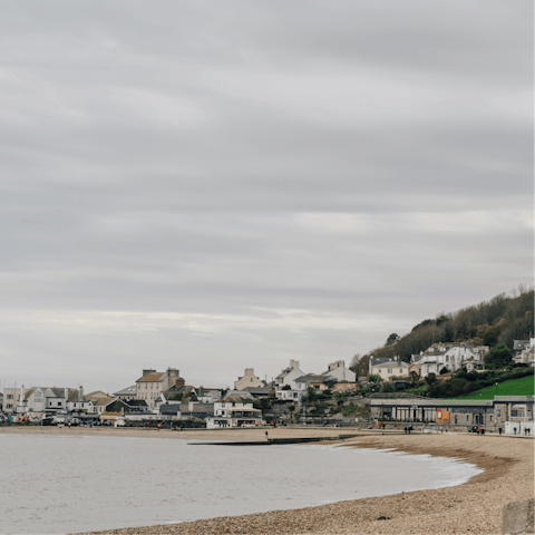 Stroll along Lyme Regis beach, breathing in the refreshing sea air