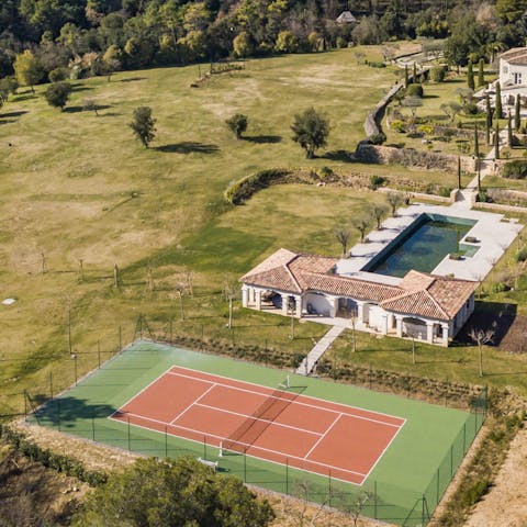 Practice your serve on the outdoor tennis court
