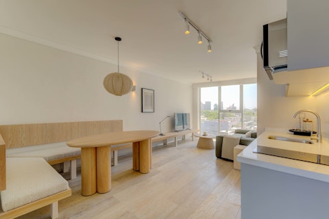 Dine and relax with city views framing the room