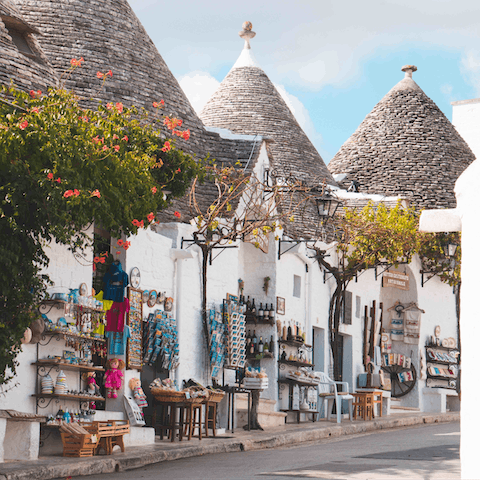 Admire the traditional 'trulli' of Alberobello and Cisternino