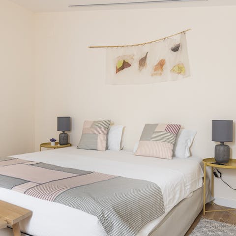 Sleep soundly in the pastel-hued bedroom