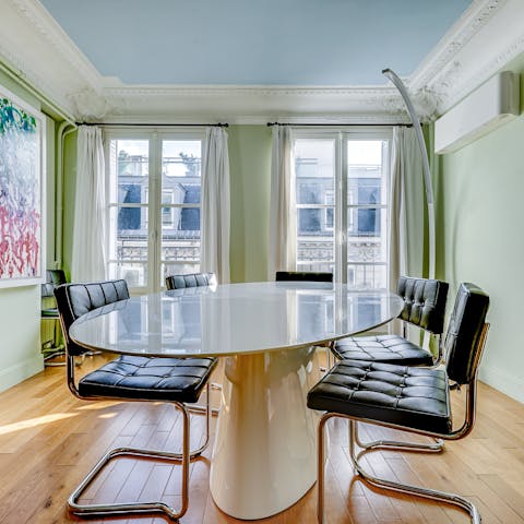 Come together for a French-inspired meal at the stylish dining table