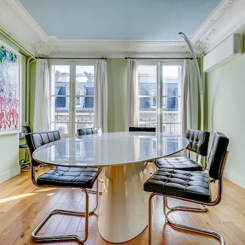 Come together for a French-inspired meal at the stylish dining table