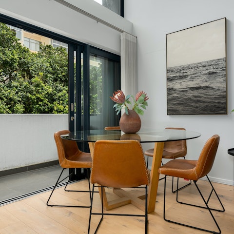 Sit down for lunch in the dining area with the balcony doors thrown open