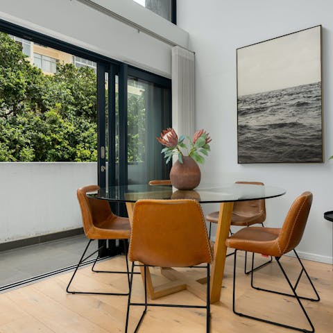Sit down for lunch in the dining area with the balcony doors thrown open