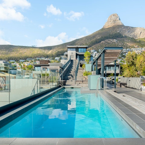 Swim lengths of the shared rooftop pool on warm afternoons