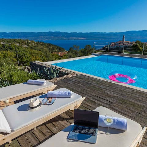 Lounge on the sun beds to top up your tan