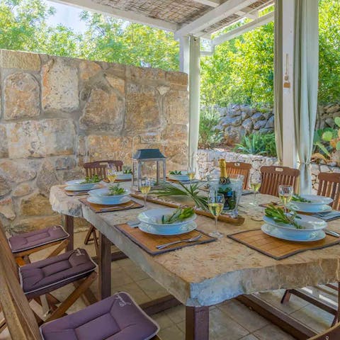 Taste the local hummus and souvlaki on the outdoor dining table