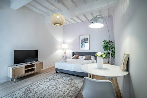 Sleep, dine, and unwind beneath whitewashed beamed ceilings