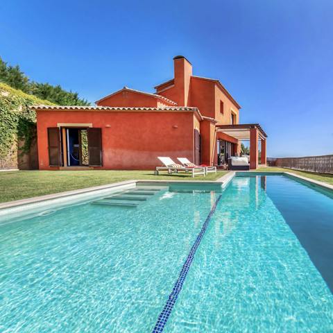 Dive into the glorious pool as you admire the view