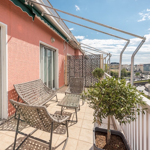 Feel connected to the vibrant heart of the city from the balcony