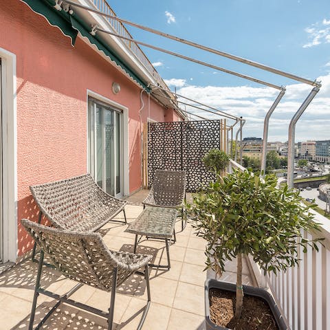 Feel connected to the vibrant heart of the city from the balcony