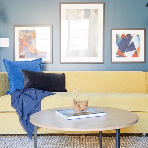 Sprawl out on the sumptuous yellow sofa and rest tired feet