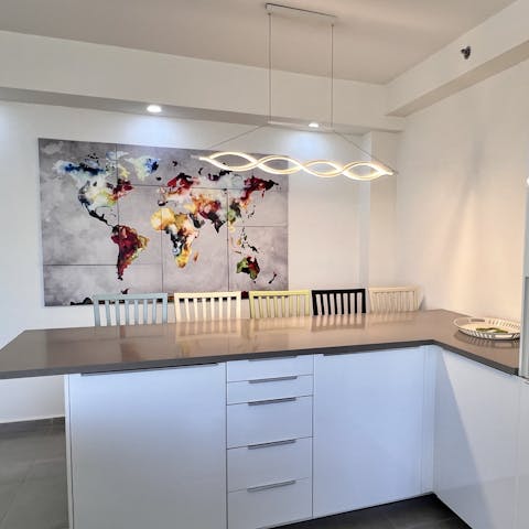 Enjoy social mornings around the sleek kitchen bar with fresh coffee