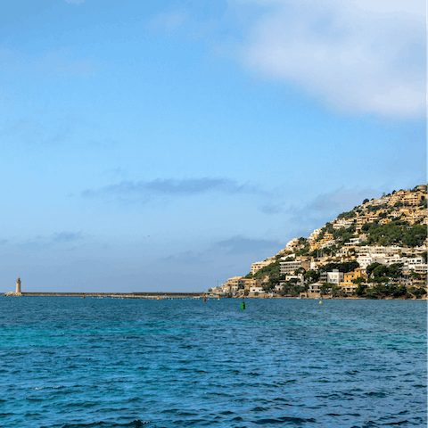 Explore the beautiful harbour town of Port d’Andratx with its stunning mountain backdrop