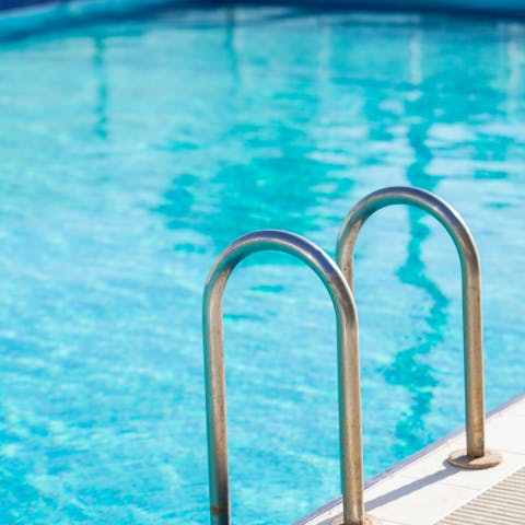 Jump into the communal pool and enjoy a swim in the desert sunshine