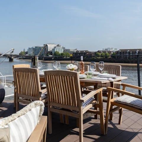 Dine alfresco with river views each evening