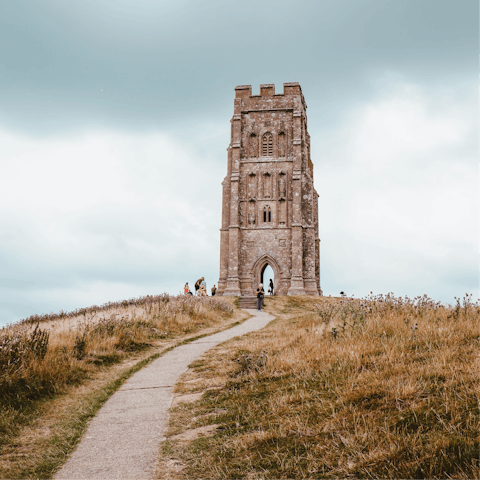 Witness amazing views of Somerset from Glastonbury tor (a twenty-minute drive)