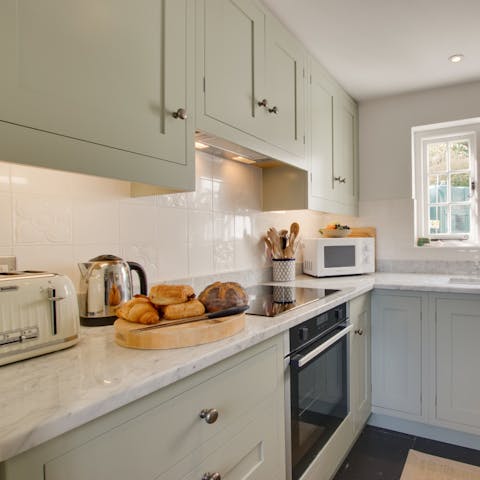 Cook a delightful seafood special for dinner in your sleek, well-equipped kitchen