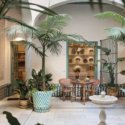 Relax around the pretty patio at the heart of the home
