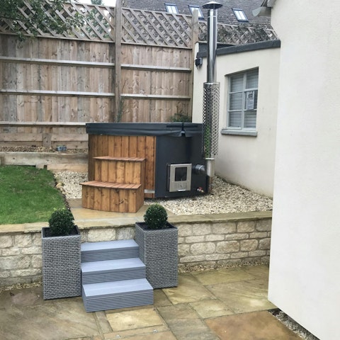 Relax with a glass of English wine in the wood-fired hot tub