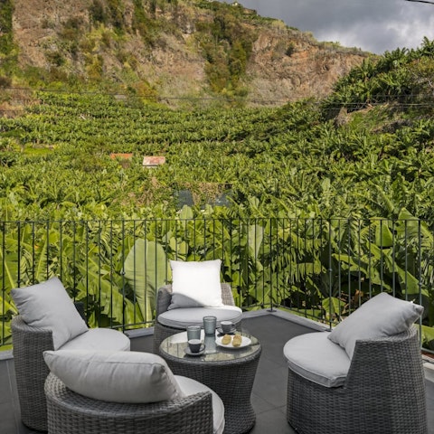 Enjoy morning coffees surrounded by tropical banana plants