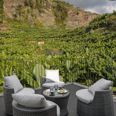 Enjoy morning coffees surrounded by tropical banana plants
