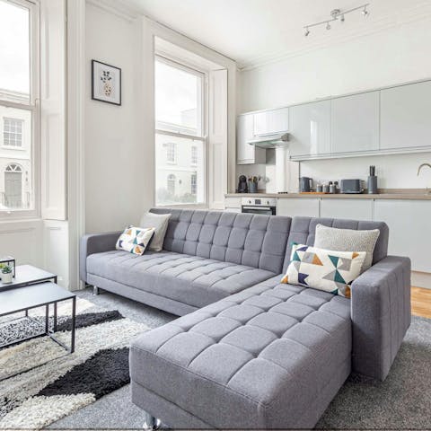 Relax in the bright open-plan living space with a glass of cider