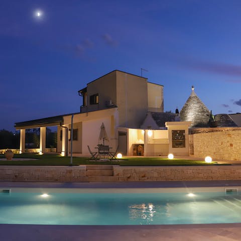 After the sun has set, enjoy a walk around the grounds of the villa