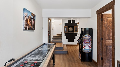 Challenge friends to shuffleboard, darts, or a classic arcade game