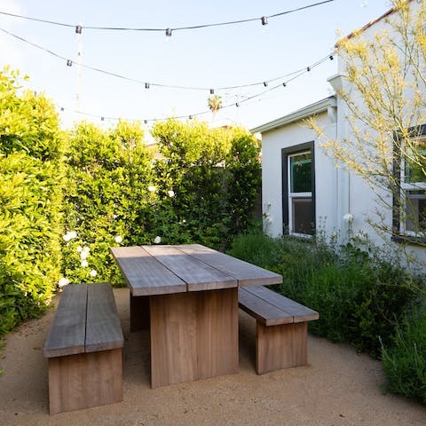 Set yourself up with a pitcher of margarita to enjoy the golden hour from your tree-lined garden