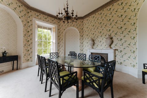 Dine in regal style beneath the chandelier