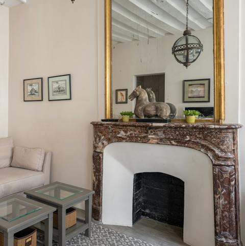 Admire original features like the marble fireplace