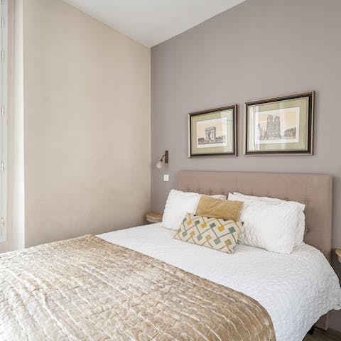 Get a good night's sleep in the soothingly toned master bedroom