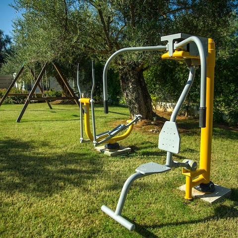 Squeeze in a workout with the outdoor gym equipment while kids let loose on the playground