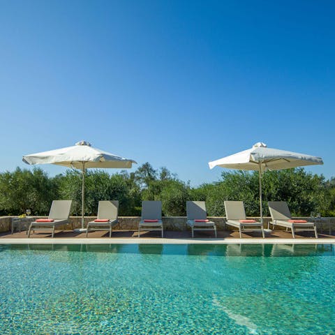 Spend sunny days lounging by the pool or splashing in the clear blue water